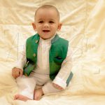 1 year traditional baby photoshoot indoor home, green jacket, white silk kurta theme props, anubhavshaphotography