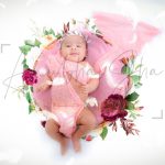 newborn infant photography, indoor home, props, anubhavshaphotography, pink wrapper, sleeping smiling girl in basket, flowers