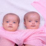 1 year twins baby photography, indoor, home, props, wrapped in pink cloths, enjoying, anubhavshaphotography