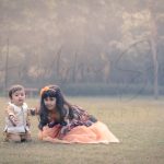 sibling photoshoot outdoor Delhi, 1 year boy in formals, 6 years girl in orange floral dress, posing, anubhavshaphotography