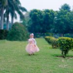 1 years poser baby photography, garden, props, girl in pink dress, tiara, running, enjoying anubhavshaphotography