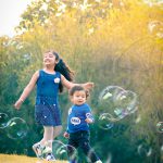 sibling photoshoot, 1 year boy and 9 years girl playing in garden, new delhi, anubhavshaphotography