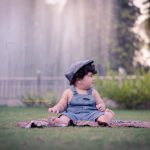 1 year sitting baby photoshoot outdoor garden water fountain traditional blue denim dress with cap