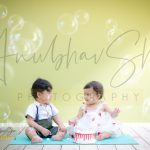 1 year twins cake smash, indoor home, bubble, girl and boy, anubhavshaphotography smiling at each other