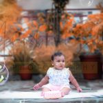 10 months cake smash theme, baby photoshoot, home terrace garden, colorful plants, sunset, clouds, props