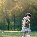 1 year poser baby photography, garden, props, girl in leapard print jacket, walking, anubhavshaphotography