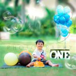 1 year orange cake smash theme baby photoshoot outdoor garden colorful balloons sunset clouds props