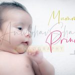 newborn infant photography, indoor home, props, anubhavshaphotography, pink wrapper, baby smiling and posing