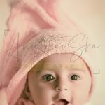 newborn infant photography, indoor home, props, anubhavshaphotography, pink wrapper, naughty baby