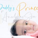 newborn infant photography, indoor home, props, anubhavshaphotography, pink wrapper, smiling face closeup