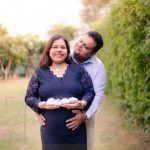 maternity pregnancy photography, outdoor, pregnant wife posing with husband, baby shoes, love, posing, care, anubhavshaphotography