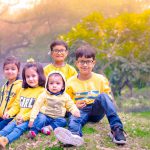 sibling photography, outdoor garden, Delhi, 5 kids, yellow dresses, smiling, posing, anubhavshaphotography