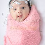 newborn infant photography, indoor home, props, anubhavshaphotography, pink wrapper, laughing baby
