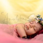 newborn infant photography, indoor home, props, anubhavshaphotography, pink wrapper, sleeping girl with makeup kit