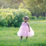 1 year poser baby photography, garden, props, girl in pink frill dress, tiara, walking, laughing, anubhavshaphotography