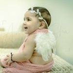 1 year sitter baby girl photoshoot home wearing wings pink cotton wrap tiara angel theme