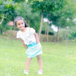 5 years poser baby photography, garden, props, girl in while tshirt, blue skirt, sunglasses on head, anubhavshaphotography