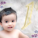 1 year sitter baby photoshoot indoor home face closeup smiling flowers fur background