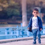 2 years poser baby photography, garden, props, boy in white tshirt, jeans, jacket, sunglasses, smiling, anubhavshaphotography