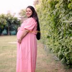 maternity pregnancy photography, outdoor, pregnant woman posing in sunset, pink gown, care, anubhavshaphotography