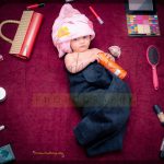 1 year poser baby photography, home, props, girl wrapped in pink and black, makeup theme, anubhavshaphotography
