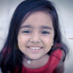 1 year poser baby photography, outdoor, garden, props, girl wearing red dress, face closeup, anubhavshaphotography