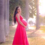 maternity pregnancy photography, outdoor, pregnant woman posing in sunset, red gown, love, care, anubhavshaphotography
