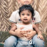 sibling photography, indoor home, Gurugram, 1 year girl, 6 years boy, white tshirt, denim jeans, posing, smiling, anubhavshaphotography