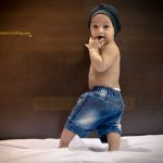 1 year poser baby photography, indoor, home, props, wearing turban and denim, turning back, anubhavshaphotography