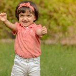 4 years poser baby photography, outdoor, garden, props, girl in pink orange tshirt and pant, enjoying, anubhavshaphotography