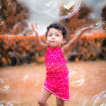 2 years poser baby toddler photography, garden, props, girl in red dress, playing with bubbles, anubhavshaphotography