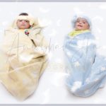 1 year twins baby photography, home, props, falling feathers, wrapped yellow blue cloth, tiara, anubhavshaphotography