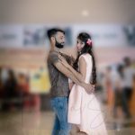 fashion photography nearby, ambience mall, Gurugram, man wearing brown t-shirt with denim, girl in peach dress, flowers hair band, boy holding girl, posing, anubhavshaphotography