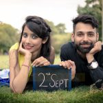 pre wedding photography, boy girl posing wedding date with slate chalk, anubhavshaphotography