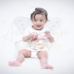 1 year baby photoshoot indoor home wearing white dress princess theme wand wings tiara
