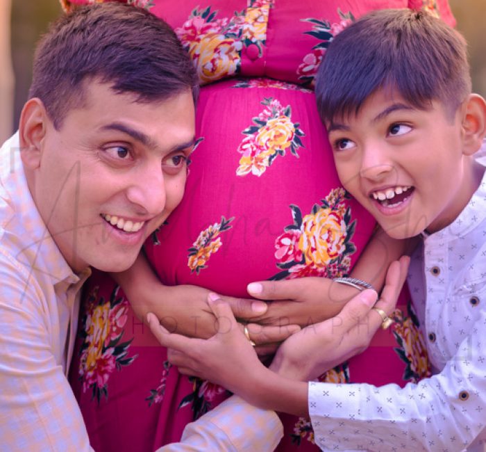 maternity pregnancy photography, outdoor, son father hearing baby in mother's belly, love, posing, care, anubhavshaphotography