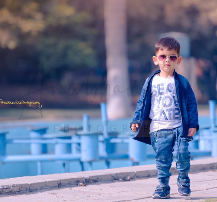 2 years poser baby photography, garden, props, boy in white tshirt, jeans, jacket, sunglasses, smiling, anubhavshaphotography