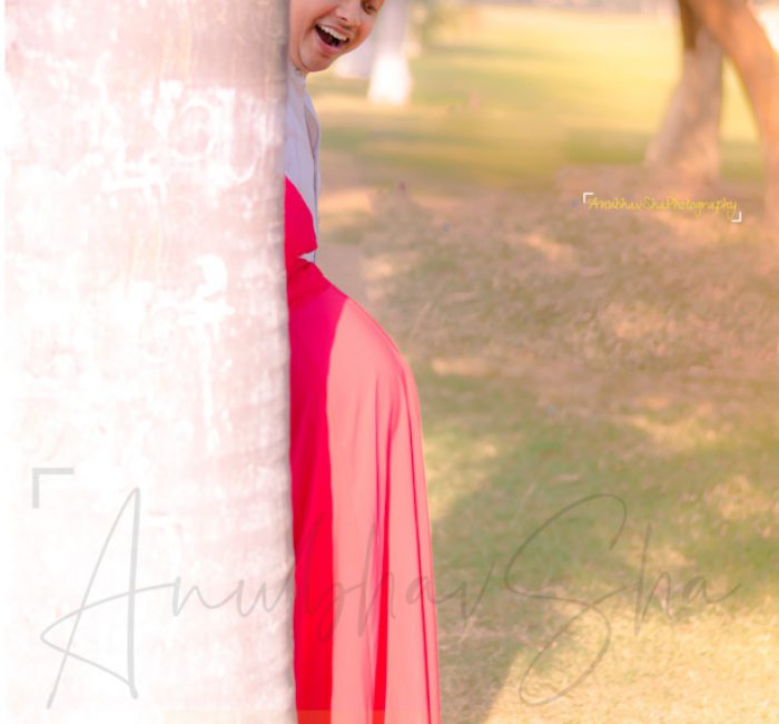 maternity pregnancy photography, outdoor, husband looking at pregnant wife's belly, love, posing, care, anubhavshaphotography