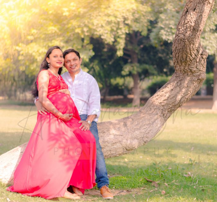 maternity pregnancy photography, outdoor, pregnant wife sitting on husband lap, love, posing, care, anubhavshaphotography